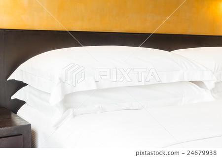 White pillow on bed 24679938