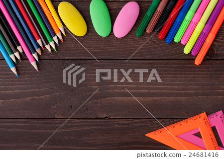 School supplies on a wooden table School supplies on a wooden table 24681416