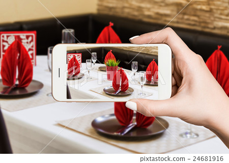 Woman photographing on smartphone, interior of Woman photographing on smartphone, interior of 24681916