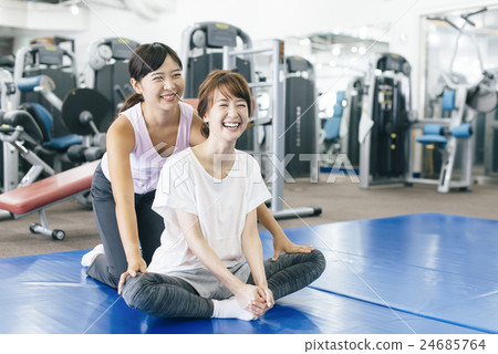 Women exercising at fitness gym Women exercising at fitness gym 24685764