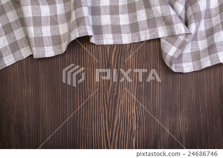 checkered tablecloth on wooden table 24686746