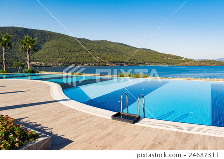 Swimming pool on bright summer day 24687311