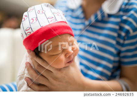 Mom holding newborn baby's in her hand Mom holding newborn baby's in her hand 24692635