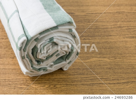 White and Green Kitchen Towel on Wooden Table White and Green Kitchen Towel on Wooden Table 24693286