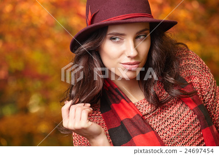 woman and fall yellow, red maple park background. woman and fall yellow, red maple park background. 24697454