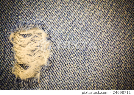Vintage jeans torn denim background. Vintage jeans torn denim background. 24698711