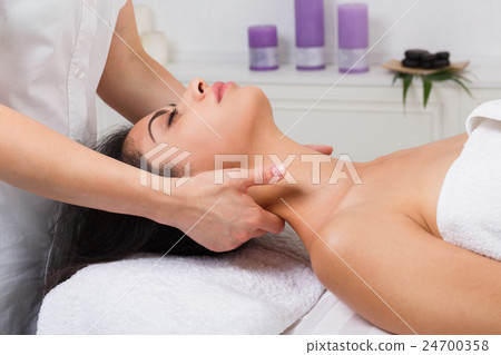 Woman beautician doctor make neck massage in spa Woman beautician doctor make neck massage in spa 24700358