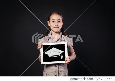 Happy girl shows screen of Digital Tablet with Happy girl shows screen of Digital Tablet with 24700562