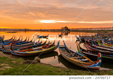 Wooden boat in Ubein Bridge at sunrise 24700717