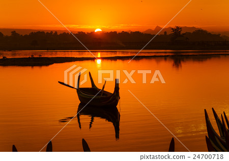 Wooden boat in Ubein Bridge at sunrise 24700718