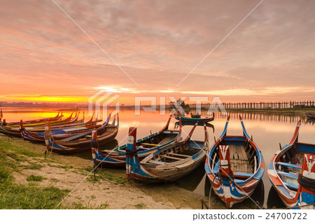 Wooden boat in Ubein Bridge at sunrise 24700722