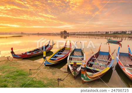 Wooden boat in Ubein Bridge at sunrise 24700725