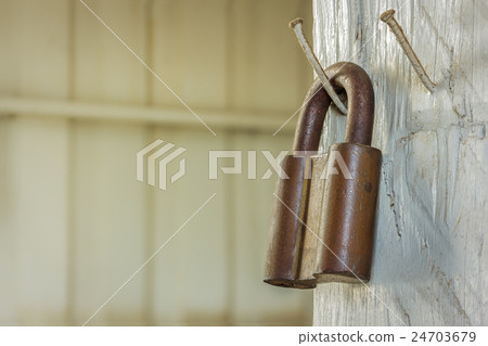 rusty old metal padlock 24703679