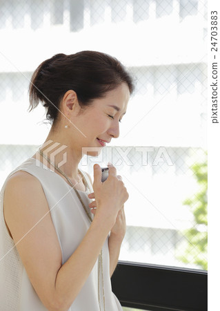Woman with smartphone Woman with smartphone 24703883