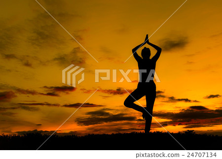 Silhouette young woman practicing yoga Silhouette young woman practicing yoga 24707134