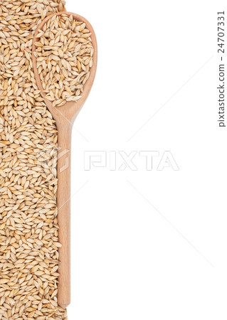barley with a wooden spoon 24707331