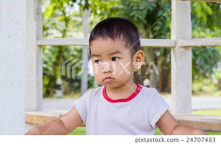 Portrait of a happy little boy in the park 24707483