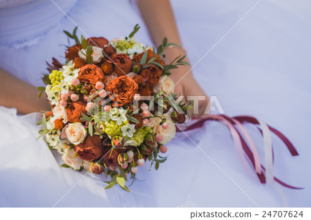 Bride in White Dress Holding Splendid Bridal Bride in White Dress Holding Splendid Bridal 24707624