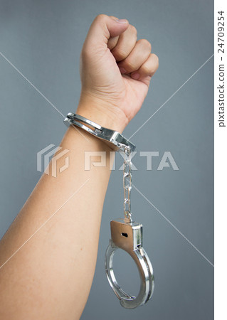 hand with shackle on cement 24709254