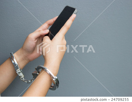 addict mobile phone concept with hand and bracelet 24709255