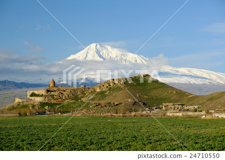 Ancient monastery in front of mountain 24710550