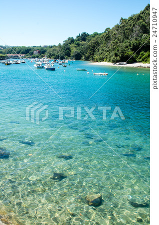 Emerald green cove on the side of Spain Bilbao Oyama and numerous boats Emerald green cove on the side of Spain Bilbao Oyama and numerous boats 24710947