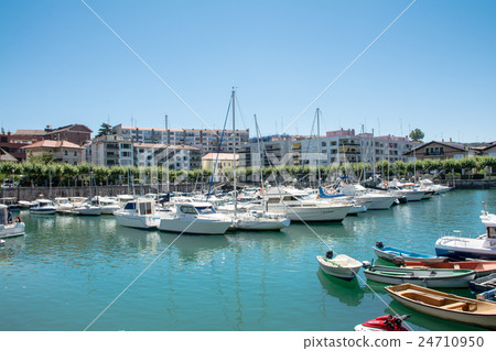 Spain Bilbao residential area and a boat and a yacht floating in the river Spain Bilbao residential area and a boat and a yacht floating in the river 24710950