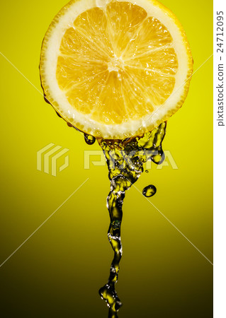 Fresh water drops on lemon at yellow background Fresh water drops on lemon at yellow background 24712095