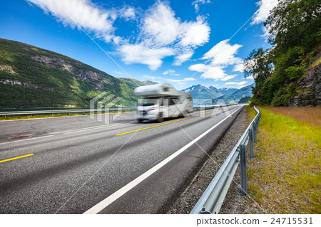 Caravan car travels on the highway. 24715531