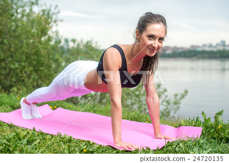 Fit woman doing full plank core exercise fitness Fit woman doing full plank core exercise fitness 24720135
