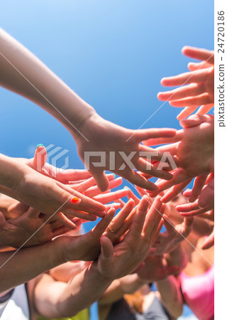 Group of women putting their beauty hands together 24720186