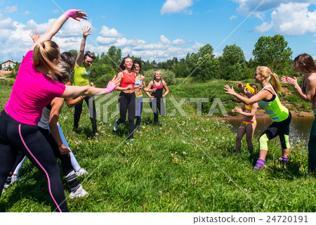 Group of women running outdoors having fun in 24720191