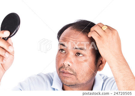 young men use the mirror looking bald 24720505