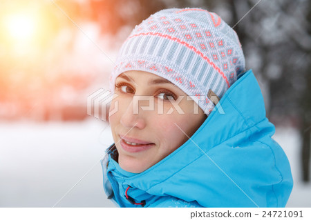 Close up outdoor portrait of young woman in winter 24721091