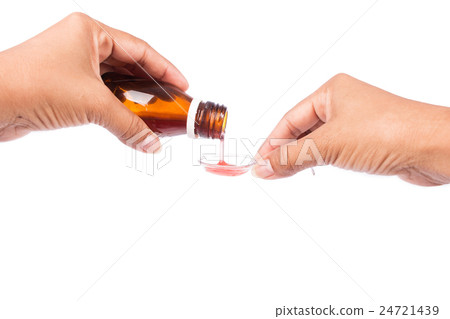 hands mather pouring medicine in a spoon 24721439