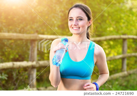 Woman running outdoors Woman running outdoors 24721690