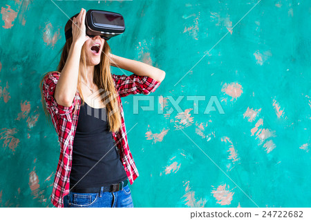 Young Woman feeling shocking for using the virtual Young Woman feeling shocking for using the virtual 24722682