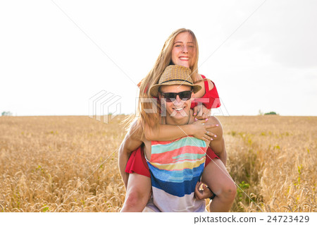Happy Couple Having Fun Outdoors on wheat field 24723429