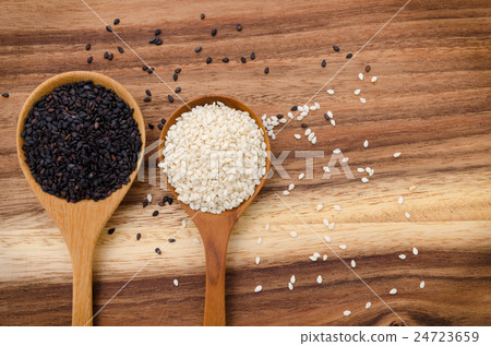Sesame seed in wooden spoon. 24723659