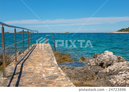 Pathway on the rocky beach in Istria 24723896