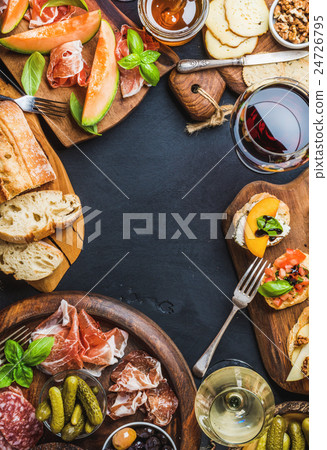Italian antipasti wine snacks set over black Italian antipasti wine snacks set over black 24726795
