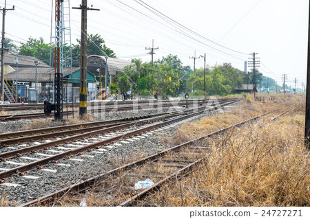 Vacant Rail way switch track with yellow die grass 24727271