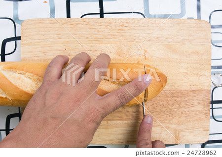 Chef slicing bread Chef slicing bread 24728962