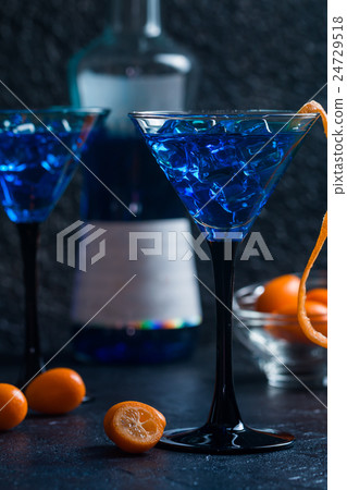 Blue cocktail in martini glasses 24729518