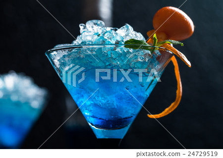 Blue cocktail in martini glasses Blue cocktail in martini glasses 24729519