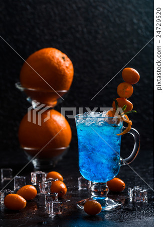 Blue cocktail in martini glasses Blue cocktail in martini glasses 24729520