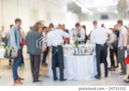 Abstract blurred people socializing during coffee Abstract blurred people socializing during coffee 24733332