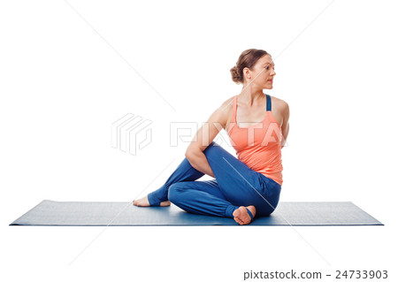 Woman doing Ashtanga Vinyasa Yoga asana 24733903