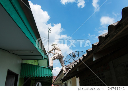 young man working install antenna young man working install antenna 24741241