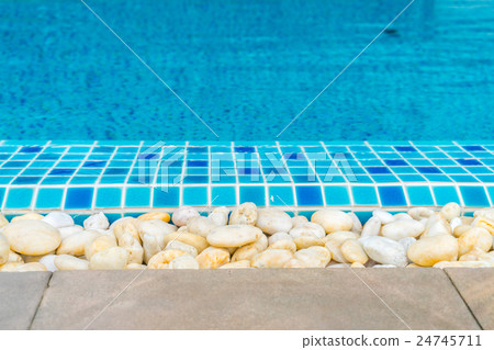Blue swimming pool rippled water . Blue swimming pool rippled water . 24745711